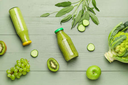 Composition with healthy smoothie and ingredients on tableの写真素材