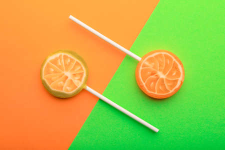 Sweet lollipops on color backgroundの写真素材