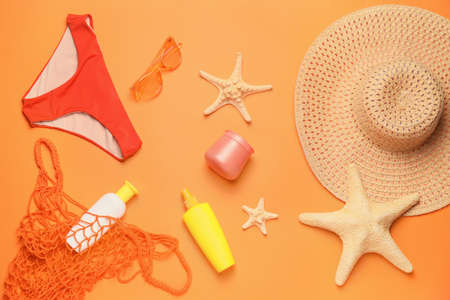 Summer composition with beach accessories on color backgroundの写真素材