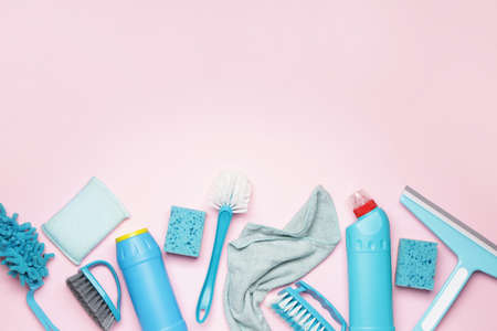 Set of cleaning supplies on color background
