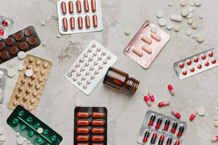 Different pills on gray backgroundの写真素材