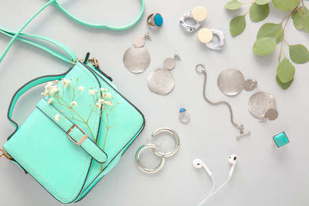 Beautiful jewelry with female accessories on light backgroundの写真素材