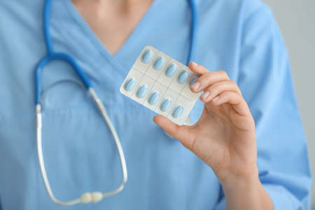 Female doctor with pills, closeup