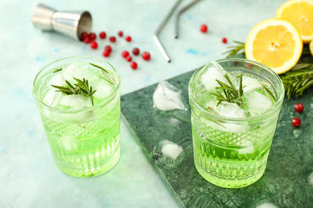 Glasses of healthy cocktail on color backgroundの写真素材