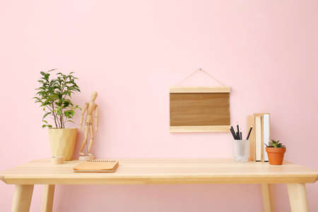 Modern stylish workplace near color wallの写真素材