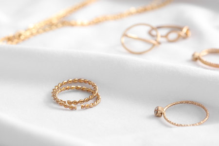 Beautiful jewelry on white clothの写真素材