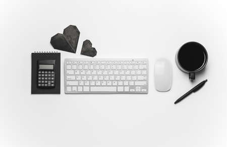 Composition with cup of coffee, PC keyboard and calculator on white backgroundの写真素材