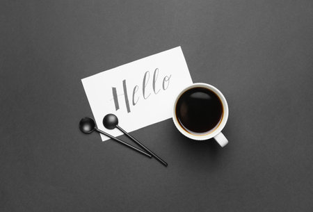 Composition with cup of coffee on black backgroundの写真素材