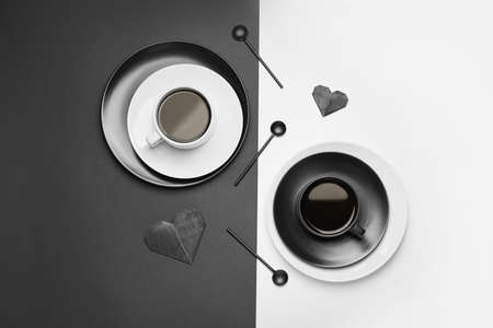 Composition with cups of coffee on black and white backgroundの写真素材