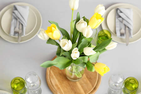 Served table with flowers in modern dining room, top viewの写真素材