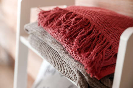 Soft plaids on shelf, closeup