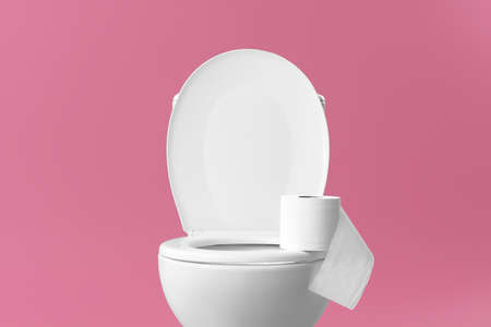 Toilet bowl with roll of paper on color background