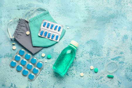 Cough medicines with medical masks on color backgroundの写真素材