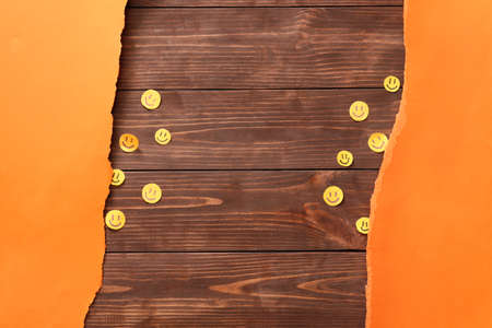 Paper smiles on wooden backgroundの写真素材