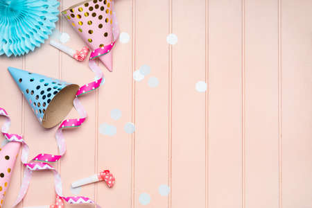 Party hats and decor on wooden backgroundの写真素材