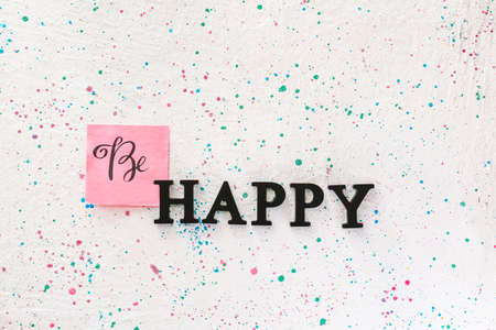 Text BE HAPPY on light backgroundの写真素材