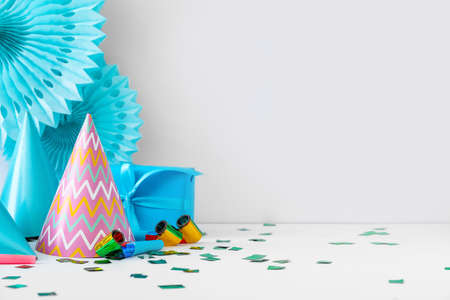 Party hats and decor on light backgroundの写真素材