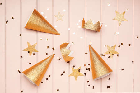 Party hats and decor on wooden backgroundの写真素材