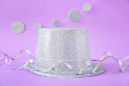 Party hat and decor on color backgroundの写真素材