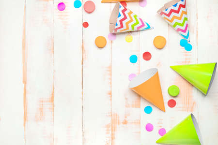 Party hats and decor on wooden backgroundの写真素材