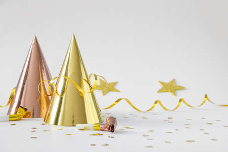 Party hats and decor on white backgroundの写真素材