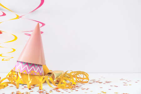 Party hats and decor on light backgroundの写真素材