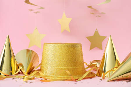 Party hats and decor on color backgroundの写真素材