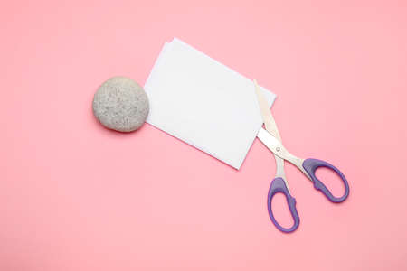 Scissors, rock and paper on color backgroundの写真素材