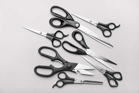 Scissors for paper on light background