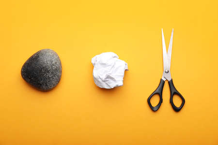 Scissors, rock and paper on color backgroundの写真素材