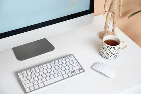 Modern workplace with computer in room