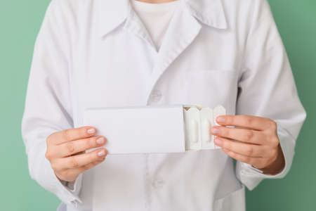 Doctor with hemorrhoidal suppositories, closeupの写真素材