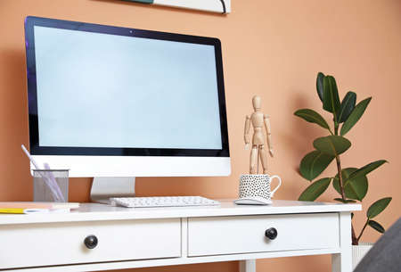 Modern workplace with computer in room