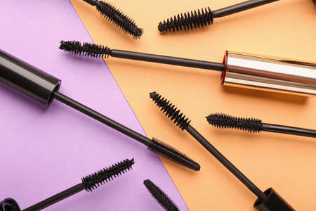 Black mascara on color background
