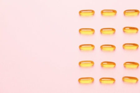 Fish oil capsules on color backgroundの写真素材