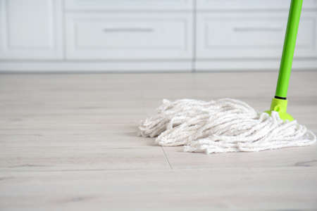 Mopping of floor in kitchenの写真素材