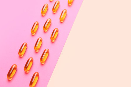 Fish oil capsules on color backgroundの写真素材