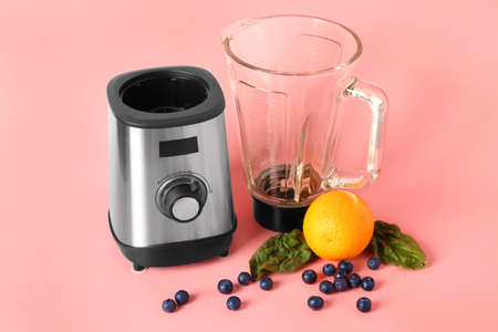 Modern blender and products on color backgroundの写真素材