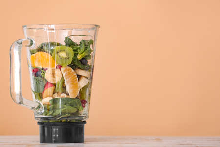 Modern blender and products on color backgroundの写真素材