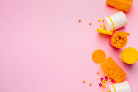 Bottles with pills on color backgroundの写真素材