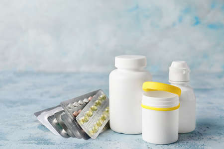 Different pills on color background