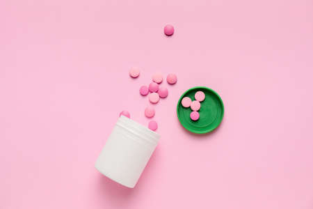 Bottle with pills on color backgroundの写真素材