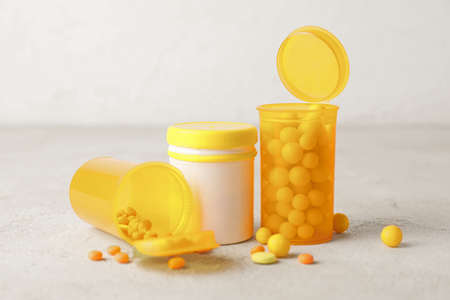 Bottles with pills on gray backgroundの写真素材