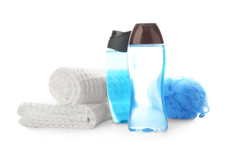Shower gels, towel and loofah on white backgroundの写真素材