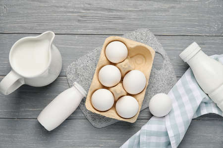 Different dairy products without lactose on wooden background