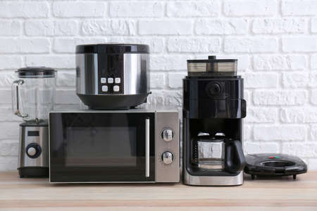 Different household appliances on tableの写真素材