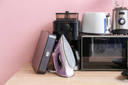 Different household appliances on table