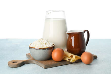 Different dairy products on table against white backgroundの写真素材