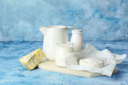 Different dairy products on color backgroundの写真素材