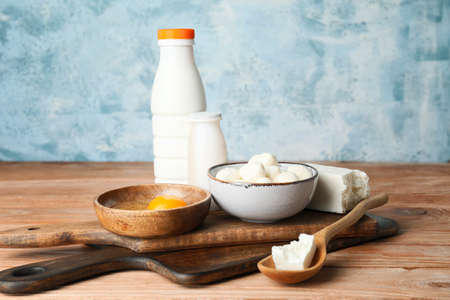 Different dairy products on wooden tableの写真素材
